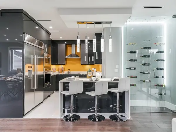 Kitchen island with bar seating and pendant lighting