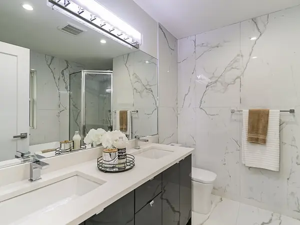 Master bathroom with book-matched marble and double vanity