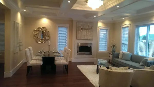 Formal dining room with coffered ceiling and fireplace