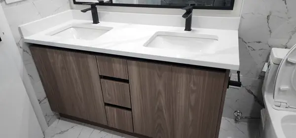 Marble-tiled bathroom with double vanity